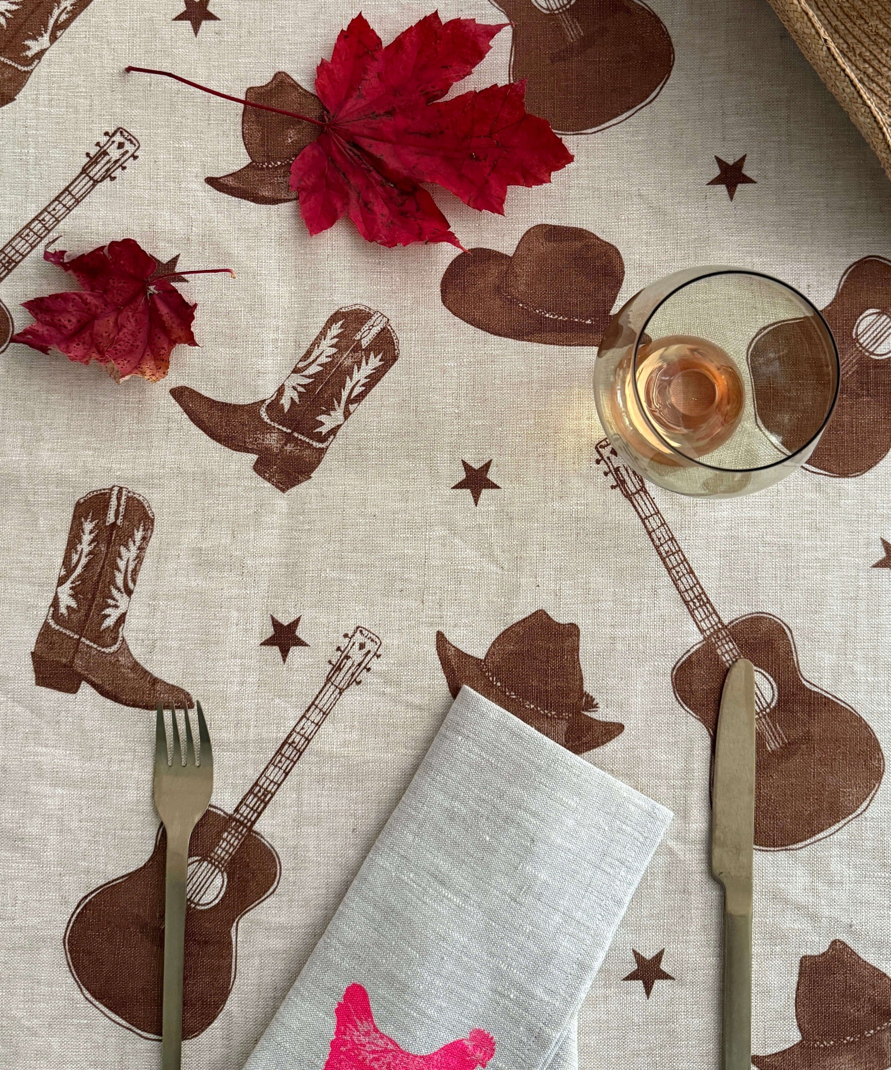tablecloth-stars-guitars-brown-overhead-hat.jpg