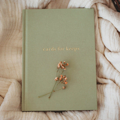 A sage coloured journal to record and keep special cards in 