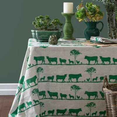 Green sheep and cattle tablecloth and table setting 