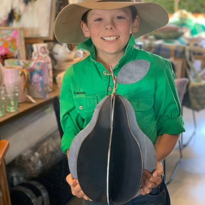 Boy holding a steel pear